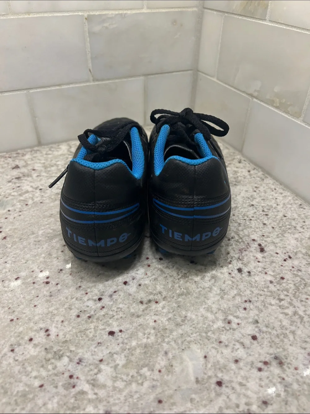 Nike Tiempo Black Soccer Cleats with Blue Interior and Trim